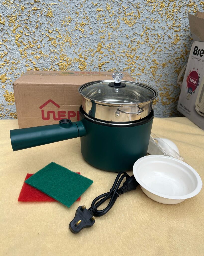 Brand new electric sauce pan with steamer